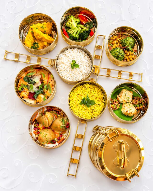 Premium Indian takeaway tiffin boxes filled with authentic curries in Blackheath.