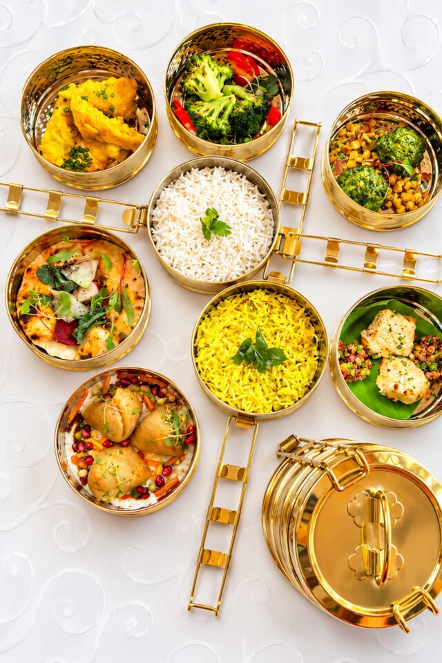 Premium Indian takeaway tiffin boxes filled with authentic curries in Blackheath.