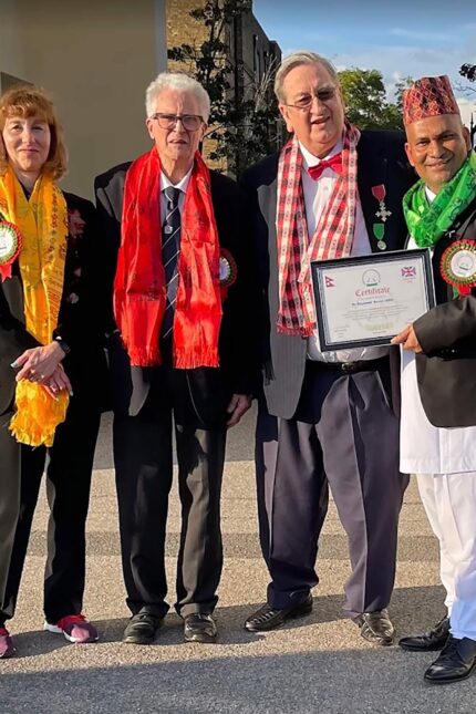 Panas Gurkha team celebrating community partnership with The Brain Trust Global Charity.
