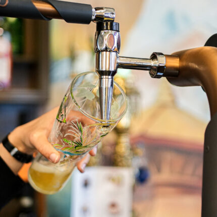 Lively bar drink service and premium beverage options at Panas Restaurant London.