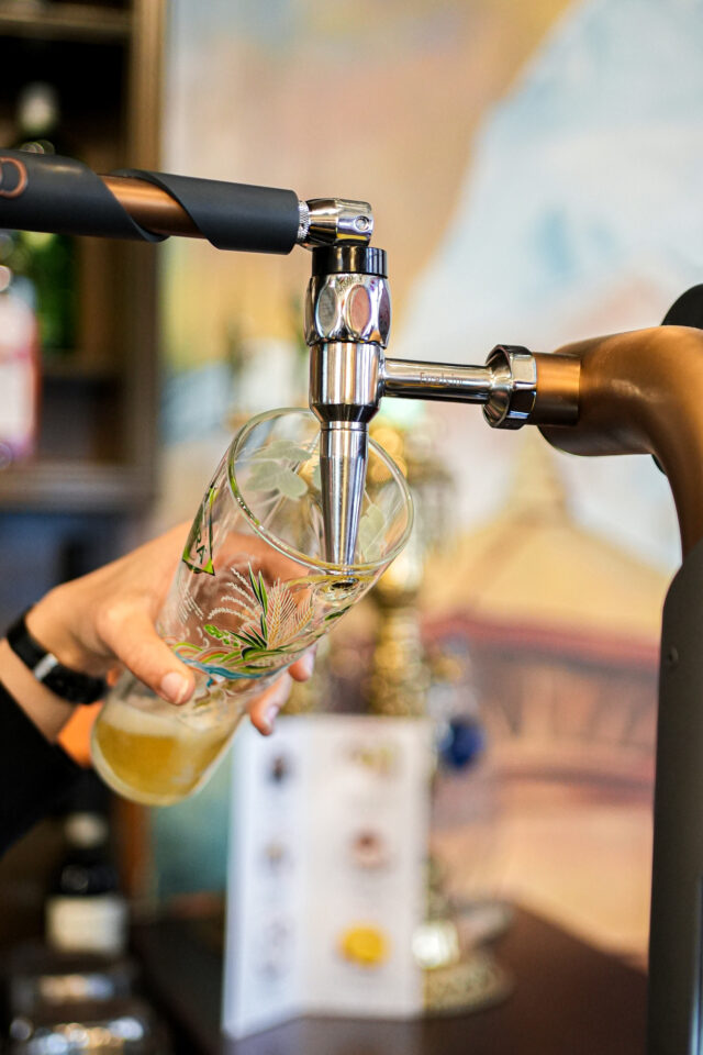 Lively bar drink service and premium beverage options at Panas Restaurant London.