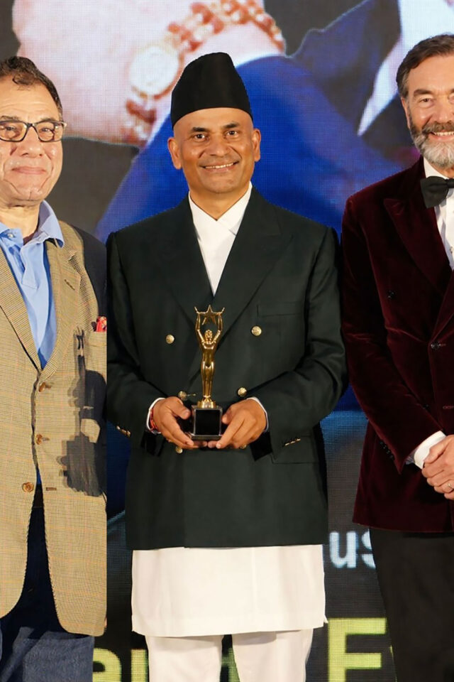 Sujan Katuwal MBE of Panas Restaurant celebrating at the British Asian Awards.