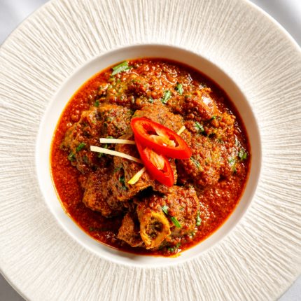 Authentic spicy Nepalese meat curry dish featured on the Panas Restaurant menu.
