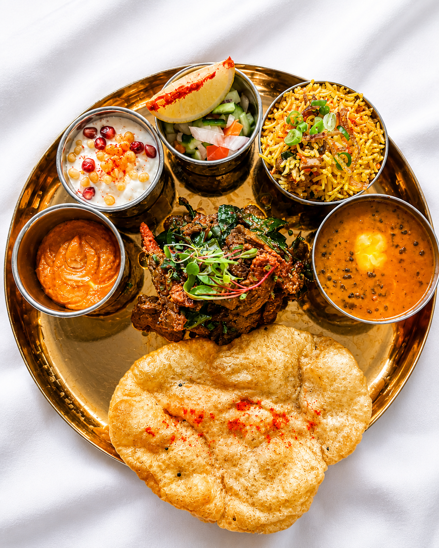 Authentic Nepalese and Indian style signature Thali dining experience on the Panas Restaurant menu.
