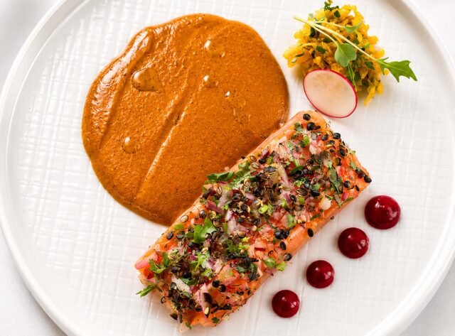 Gourmet spiced salmon dish with rich masala sauce from the Christmas party menu at Panas Gurkha Restaurant in Blackheath.